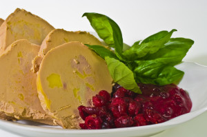 Sliced foie gras with cumberland sauce and basil leaves